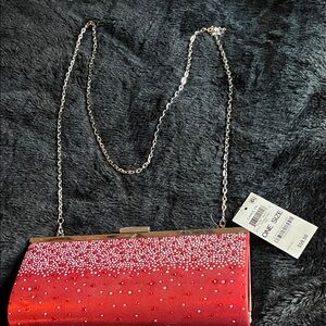 Elegant Red Clutch with Silver and Red Accents
